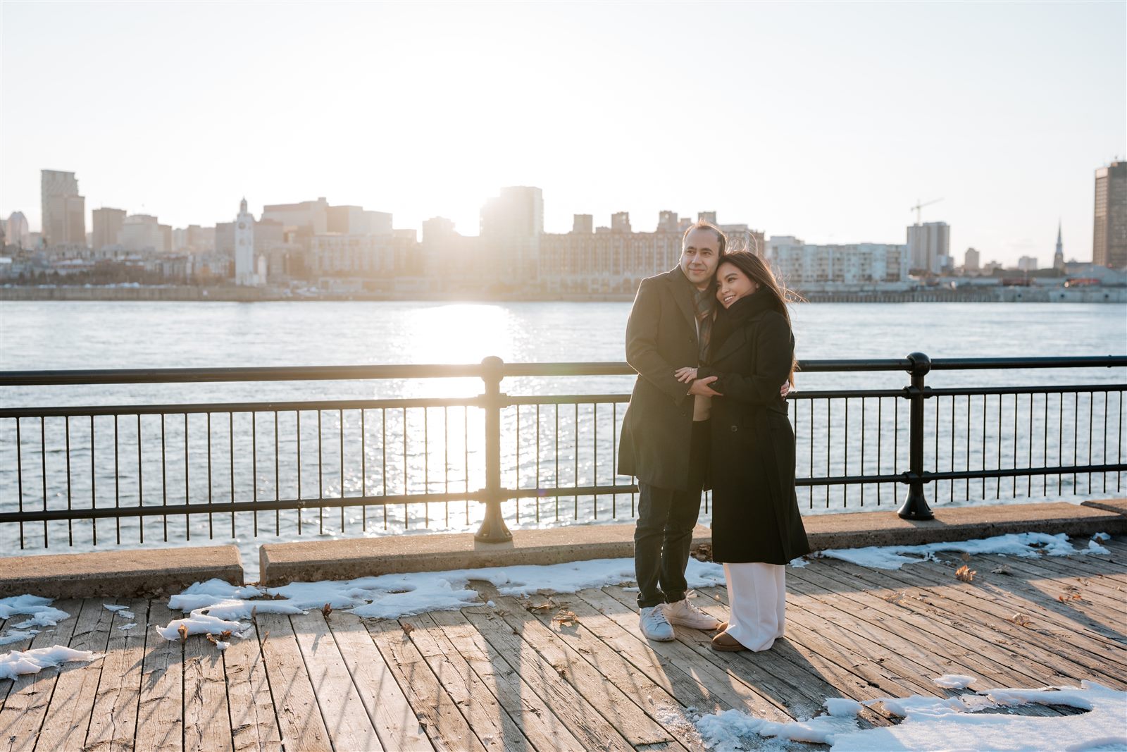 Manny and Arbie by the waterfront at sunset